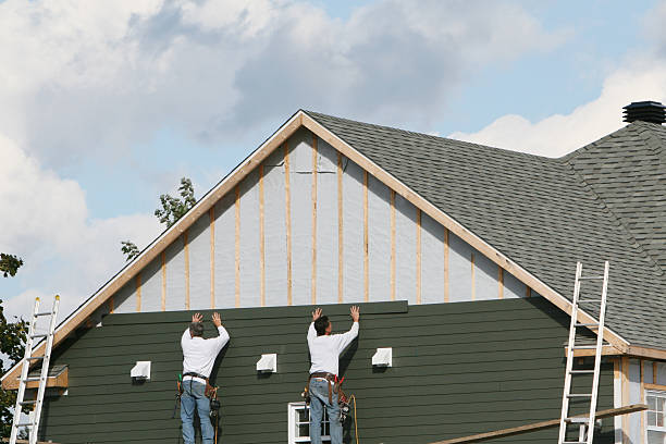 Professional Siding technician working in Utica, NY